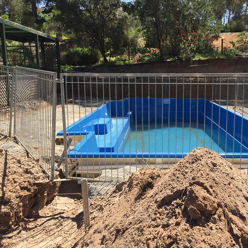 Before Stoneware White Sands pool paving and Retaining Walls